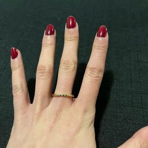 Gold-colour ring with four little stones in size 7